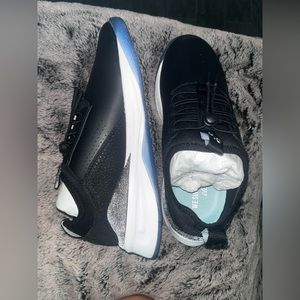 Clove black and white sneakers for healthcare workers.